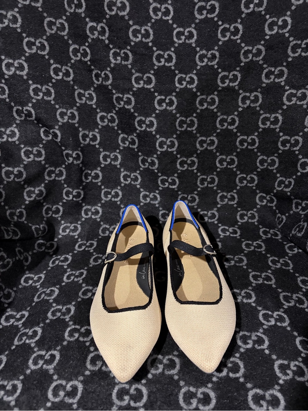 Rothy's Beige Pointed Mary Jane Flats with Black Trim and Blue Heel Accent